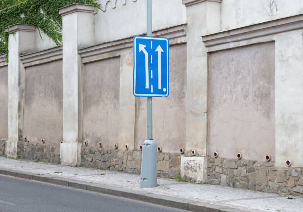Appropriate traffic lanes at crossroads junction, blue sign