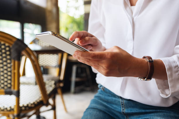 istock a woman holding and touching on mobile phone screen 1277485372