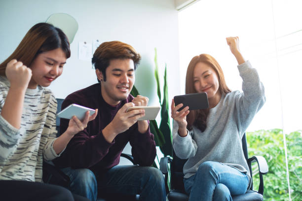 istock A group of young people having fun while watching and playing games on mobile phone together 1277485380