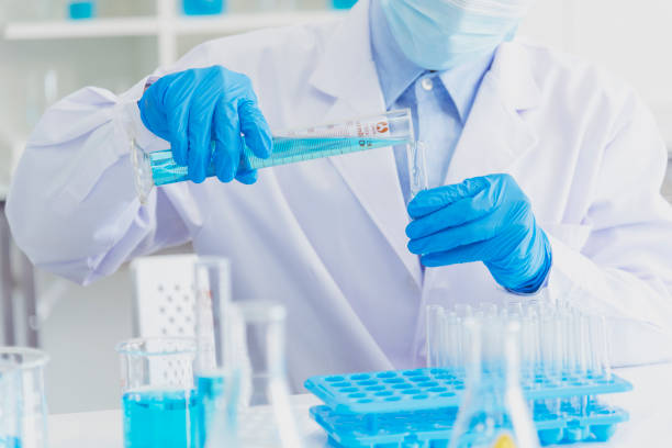 istock Scientist covid-19 virus chemistry  research experiment biotech antibody sample laboratory cultivate vaccine against virus. Scientist look at microscope, science test tube analyse Chemistry laboratory 1277487193