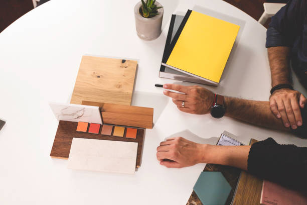 istock Close up of hands on the table during an office presentation 1277488801