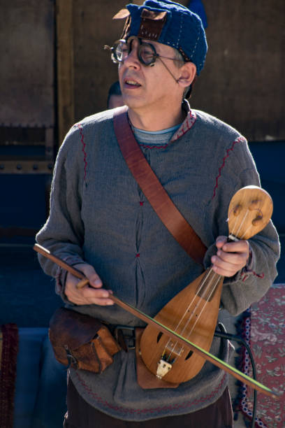 Penedono , Portugal - July 1, 2017 - Man plays Rebec string instrument in annual Medieval fair