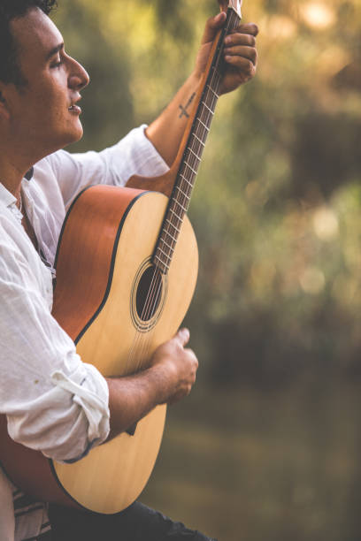 istock Man enjoying his favorite tunes playing a guitar 1277489715