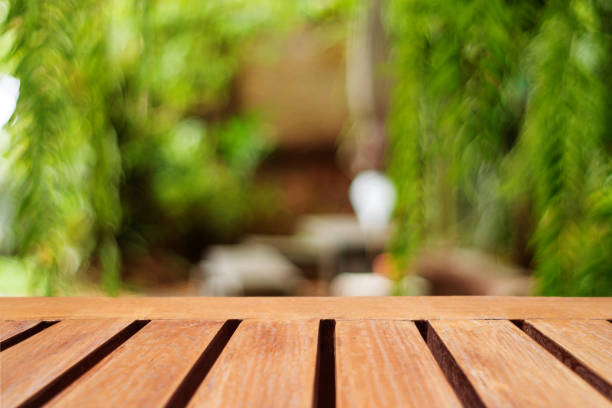 istock Selective focus of empty old wood on blur nature green leaf with bokeh abstract background. 1277490930