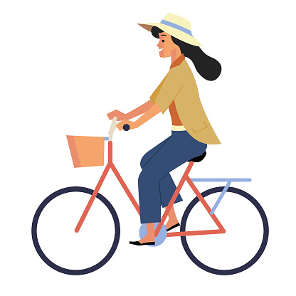 Side view of woman with hat riding a retro bicycle