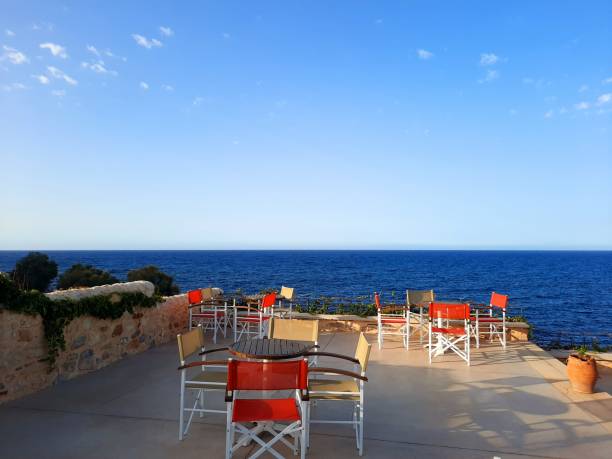 istock Red chairs with a sea view 1277491927