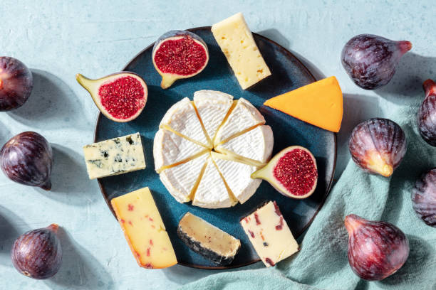 istock Many different cheeses on a plate, shot from the top with fresh figs 1277492928