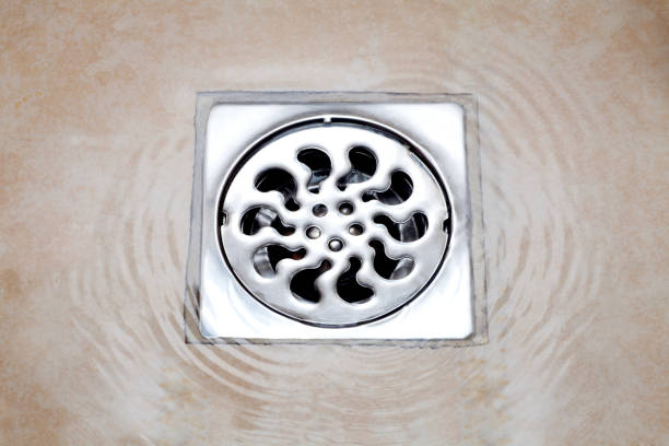 water flowing over into metal drain