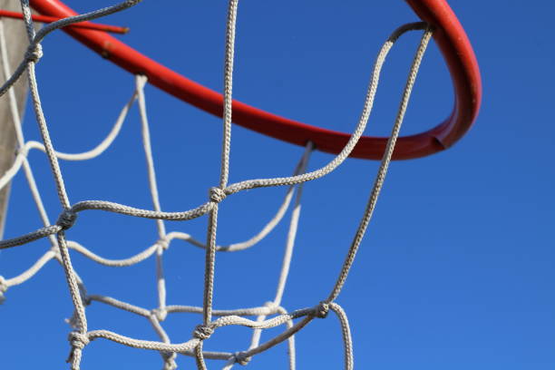 istock Street basketball loop red white basket against clear blue sky 1277493169