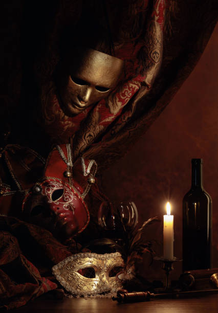 istock Carnival masks and old candlestick with burning candle. 1277495576