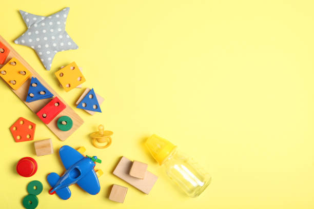 istock baby clothes on a colored background top view. Baby background 1277496809