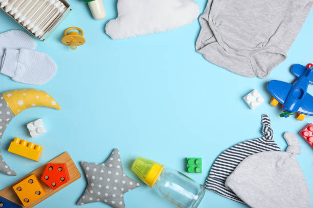 istock baby clothes on a colored background top view. Baby background 1277496876