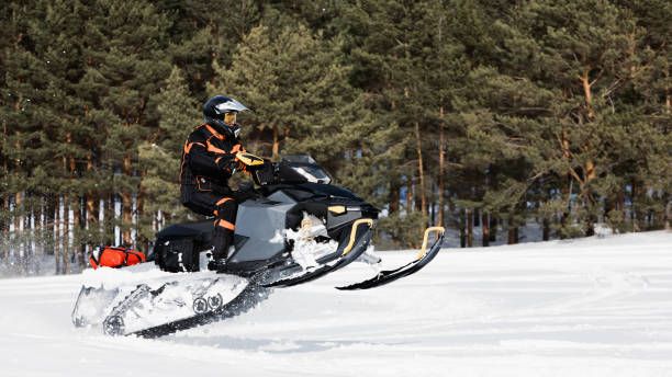 istock In deep powder snowdrift snowmobile rider driving fast. 1277497040