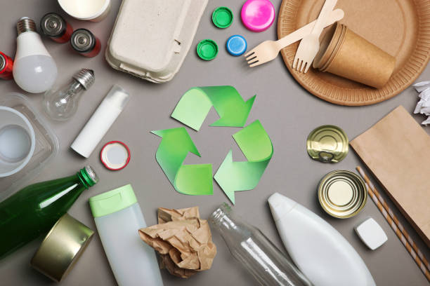 istock Different types of garbage and recycling sign on a colored background top view. The concept of nature conservation, separation and sorting of garbage. 1277497430