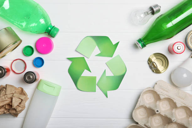 istock Different types of garbage and recycling sign on a colored background top view. The concept of nature conservation, separation and sorting of garbage. 1277497539
