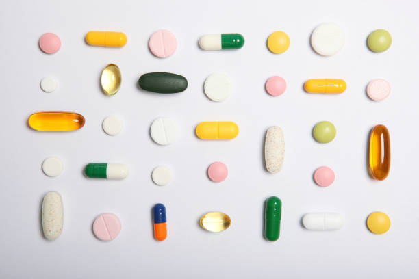 istock pills on a light background top view. Medicine, treatment, illness. Medication in tablets. 1277497606