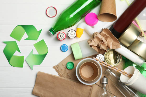 istock Different types of garbage and recycling sign on a colored background top view. The concept of nature conservation, separation and sorting of garbage. 1277497634
