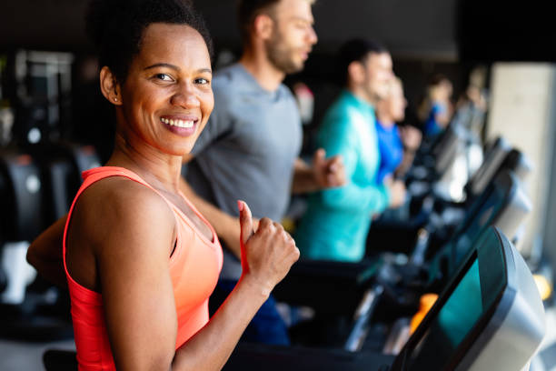 istock Young people running on a treadmill in modern gym 1277499397
