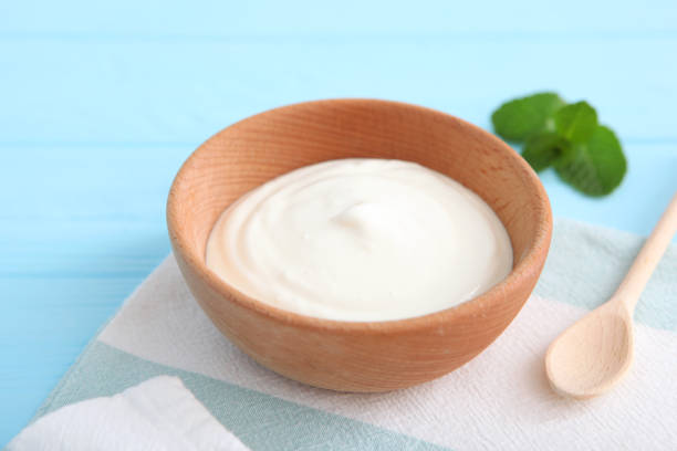 istock Natural white yogurt on the table. Healthy snack, Greek yogurt. 1277503403