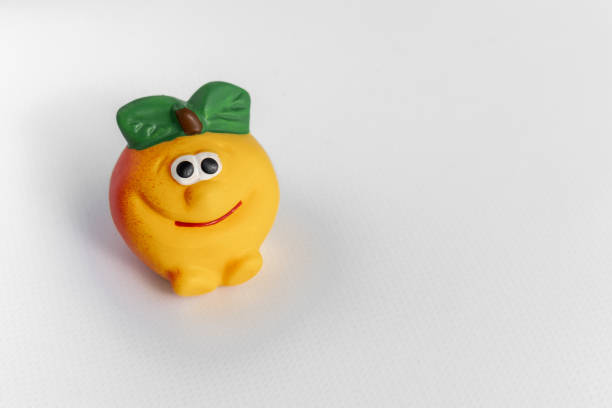 istock Children's rubber toy apple, on a white background. Development and games with children. Space for text. 1277503421
