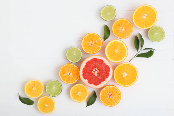istock Different citrus and juicy slices on a light background top view. Place to insert text. 1277504214