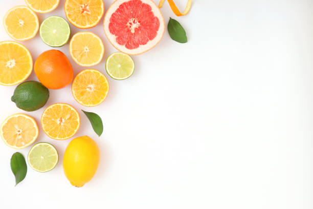 istock Different citrus and juicy slices on a light background top view. Place to insert text. 1277505578