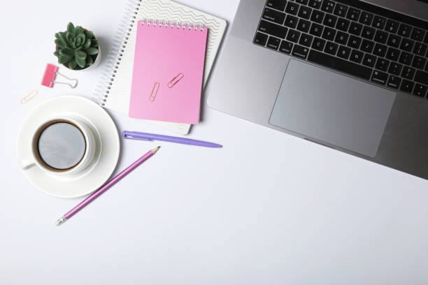 istock Modern laptop and stationery on the table top view with place for text insertion. Desktop top view. Freelance blogging. 1277506016