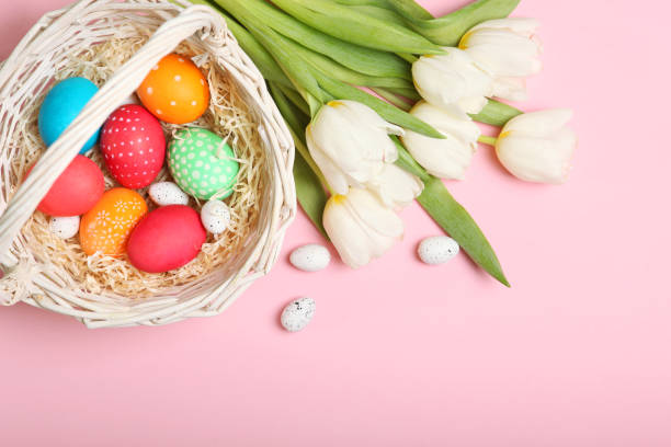 istock Easter eggs and flowers on the table top view. Easter composition with a place to insert text. 1277506740