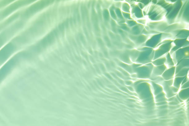 istock green transparent clear water surface texture summer background 1277507014