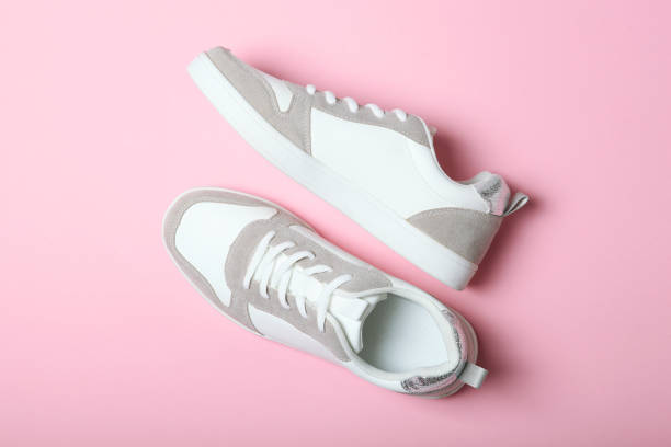 istock women's sneakers on a colored background. Women's shoes. 1277507184