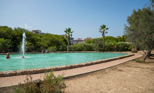 Torrevieja, Alicante Province, Spain - July 19, 2017: Molino de Agua Park, Torrevieja city in Spain. Water complex with fountains, cascades and canals in the park