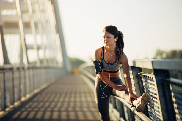 istock Sportswoman warming up on the bridge 1277508454