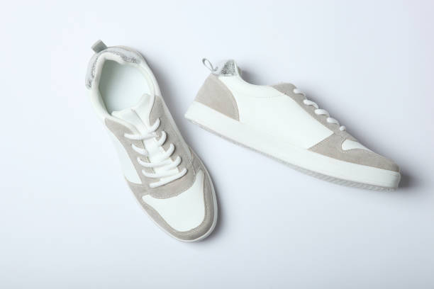 istock White women's gym shoes on a light background. 1277508826
