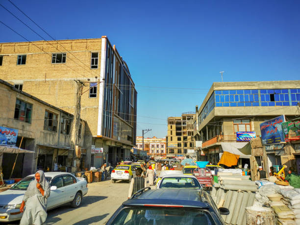 Mosul, Mossul in Iraq - November 17 2024: hustle and bustle with people and cars in the streets in the center of the city