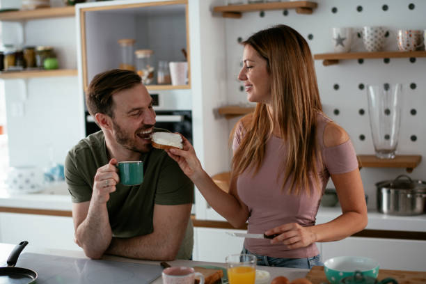 istock Young couple making breakfast at home. 1277510727