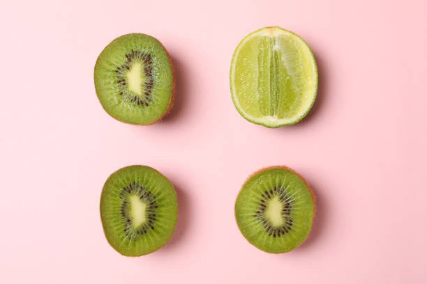 istock Lime and avocado on pink background, space for text 1277512682