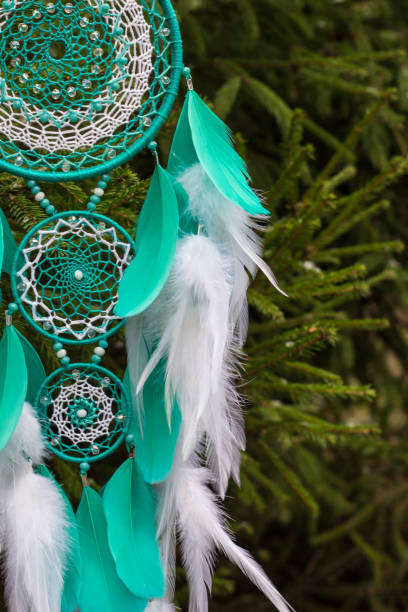 istock Handmade dream catcher with feathers threads and beads rope hanging 1277515405