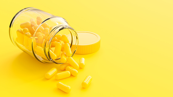 Pharmaceutical medicine pills yellow colors. Pills and glass bottle on yellow background. Minimal idea concept, 3D Render.