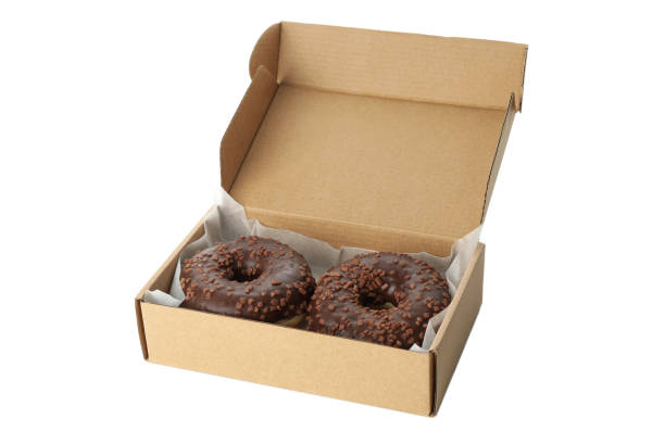 istock Carton box with donuts isolated on white background 1277516780