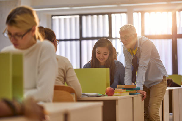 istock Female professor helping female student at the lecture 1277518201