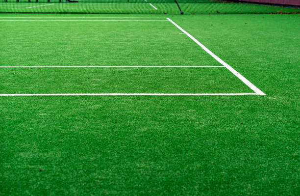 istock White lined green grass tennis court 1277518323