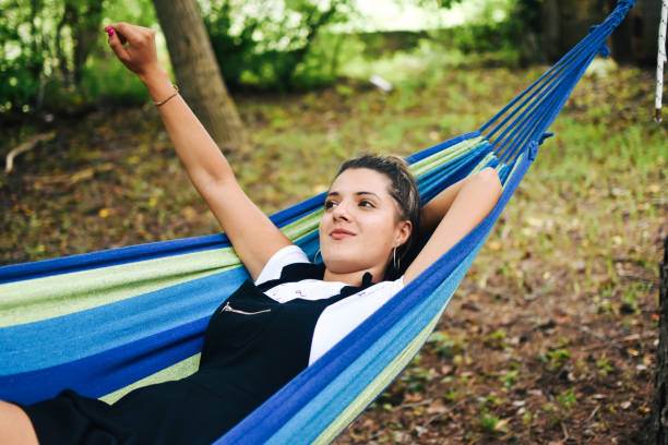 istock Beautiful woman enjoying in hammock 1277519015