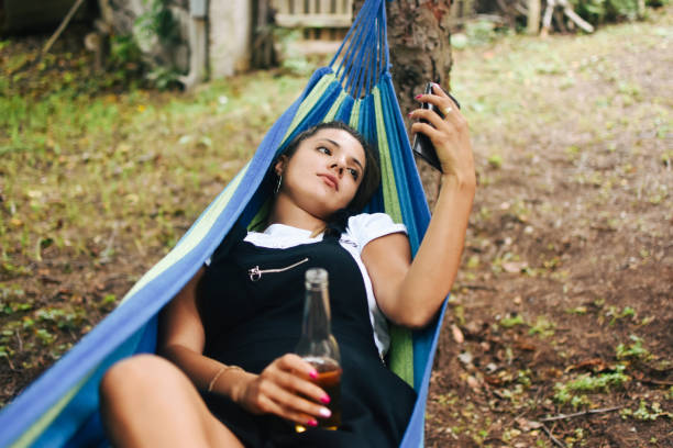 istock Beautiful woman enjoying in hammock 1277519105