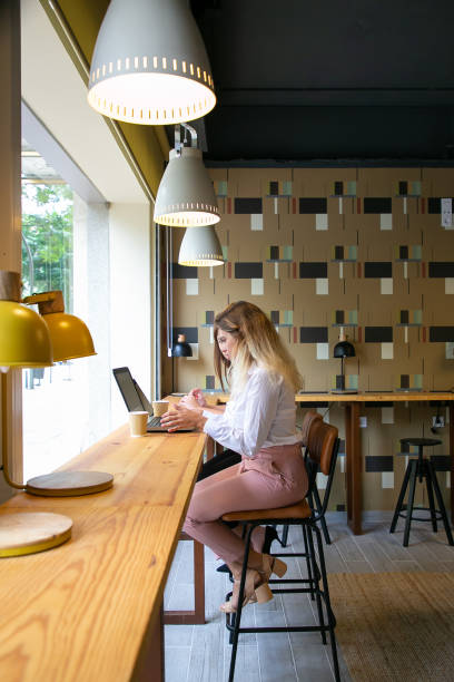 istock Young Caucasian women working on laptops and drinking coffee 1277519141
