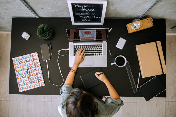 istock Young female graphic designer working on laptop in her home office 1277520109