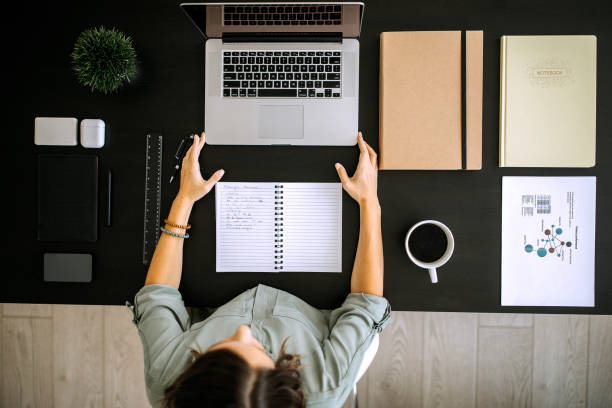 istock Woman working from home using paperwork and laptop 1277520206