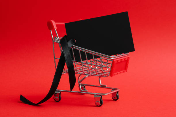 istock Shop trolley with tag on red background 1277520256