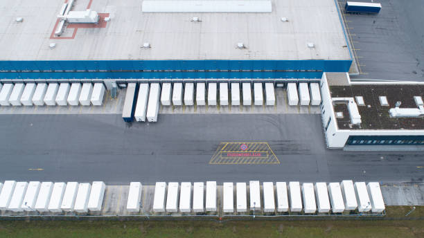 istock Loading bay, distribution logistics building, parking lot - aerial view 1277520260