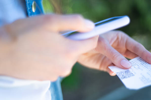 istock Qr Scan. Person scans qr code on a check from a smartphone, close-up. Financial accounting using a mobile app 1277521705