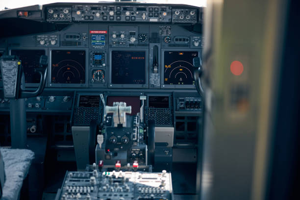 airplane cockpit with control panel and flight displays - cockpit airplane autopilot dashboard imagens e fotografias de stock